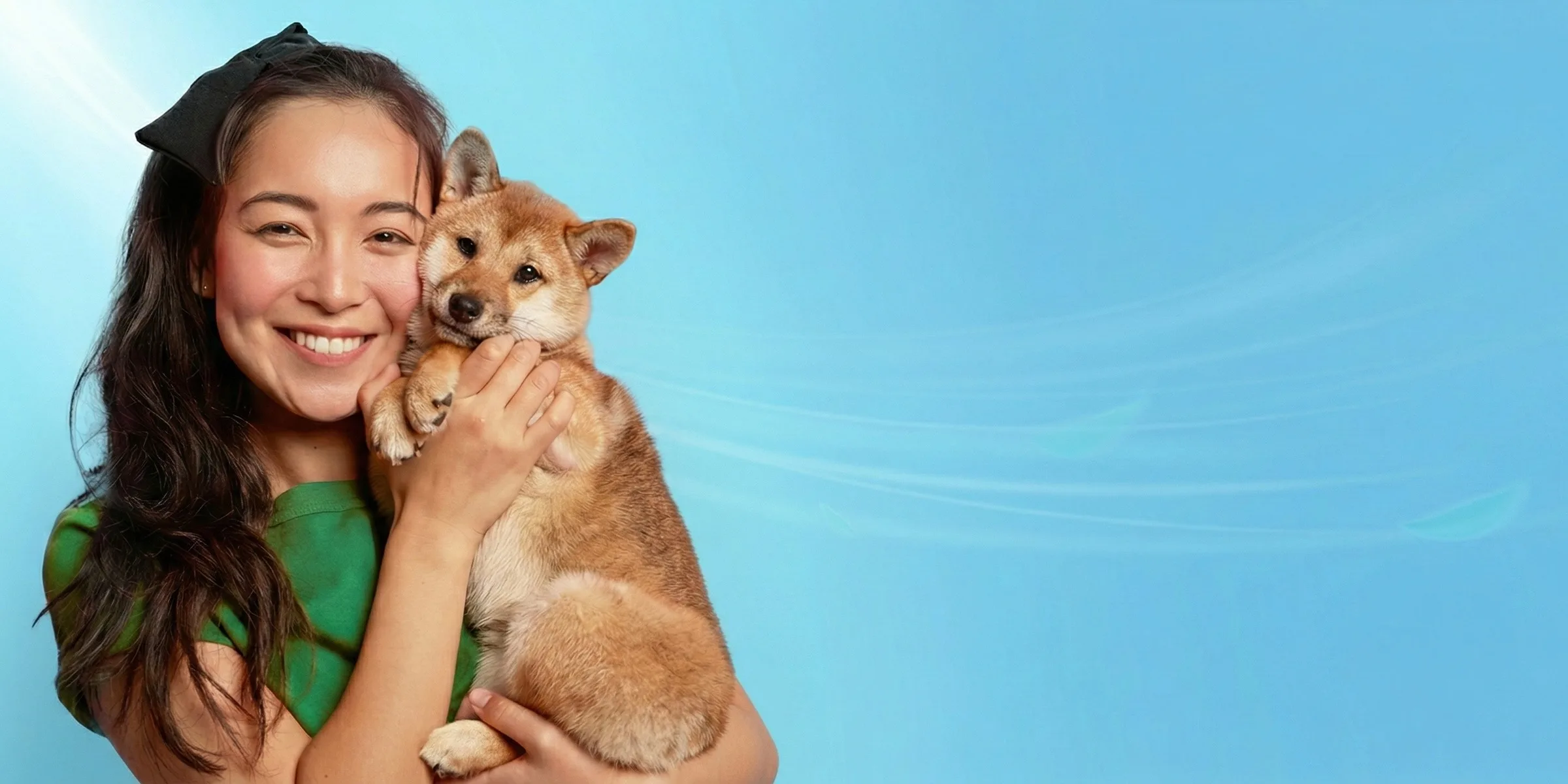 Woman holding her Shiba Inu puppy — happy pet parent